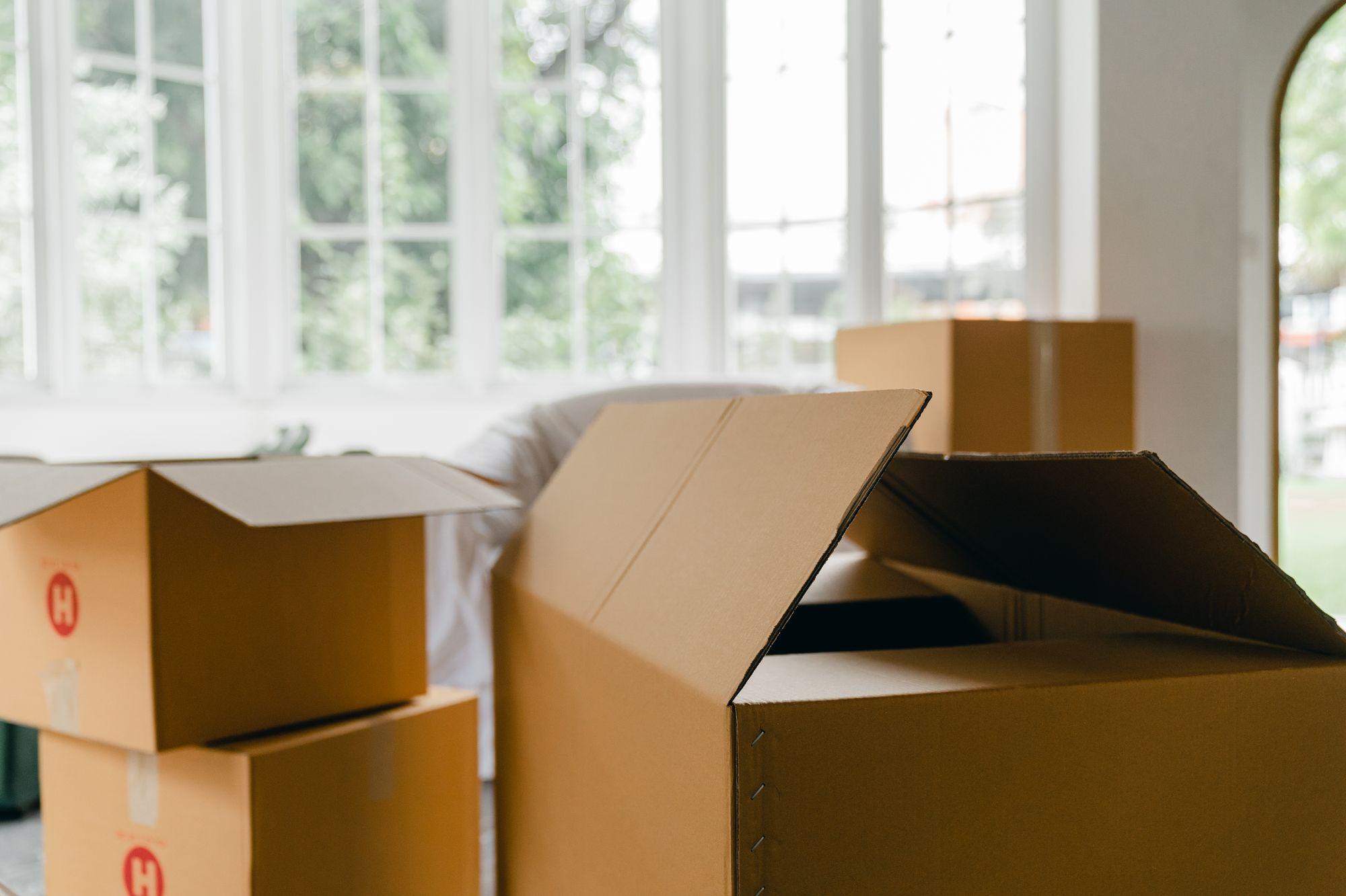 Moving boxes in a bright room ready for unpacking